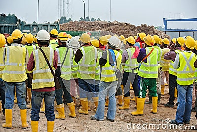 Group of construction workers assemble at the open space. Editorial Stock Photo